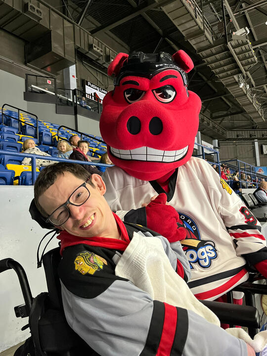 Ryan with the Rockford Ice Hogs mascot