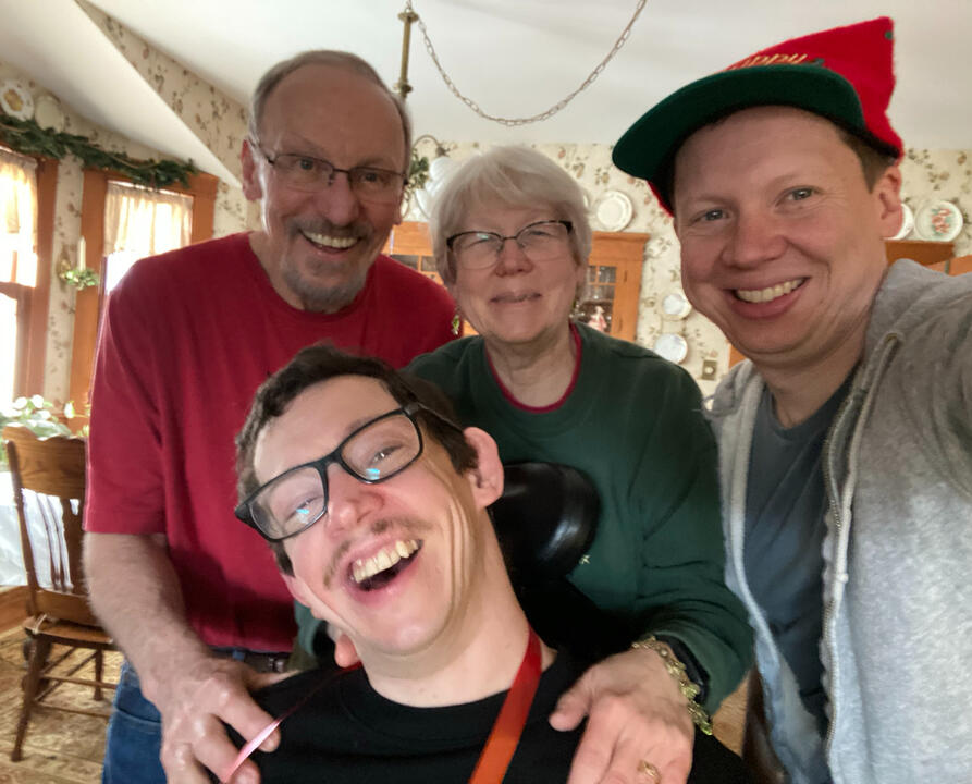 Tim, Barb, Ryan, and Sean smiling on Christmas