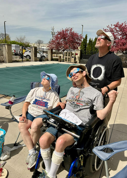 Tim, Barb, and Ryan wearing glasses to watch the eclipse