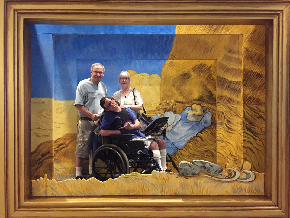 Tim, Barb, and Ryan posing inside a Van Gogh painting